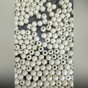 Wholesale bulk of over 300 pieces of cream colored beads for making jewelry